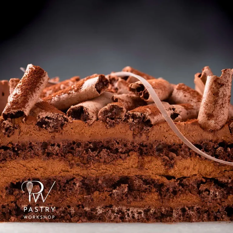 Concorde cake with dark chocolate mousse and cocoa meringue sticks