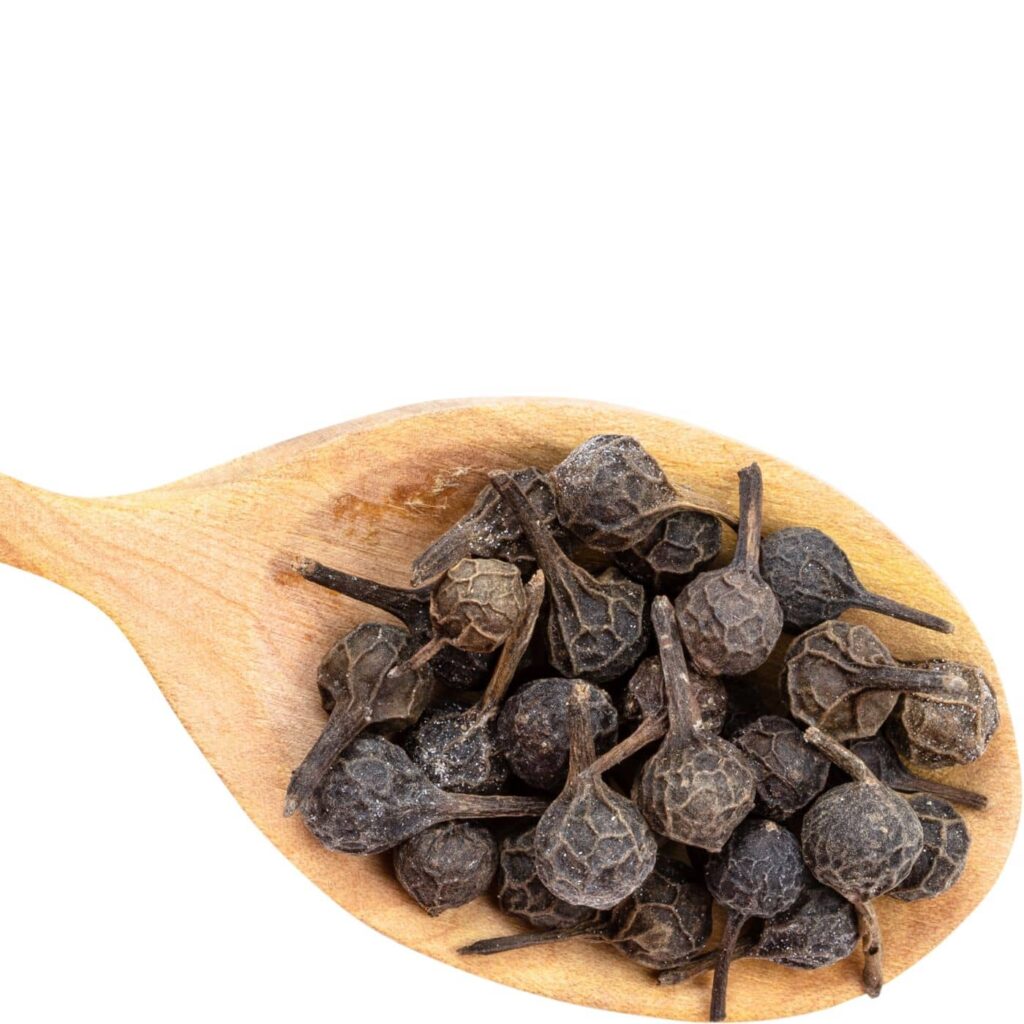 Cubeb pepper in a wooden spoon