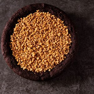 Giant peanut butter chocolate cookie cut into slices
