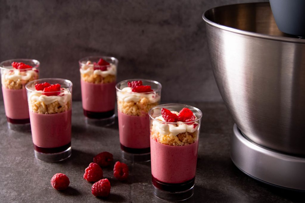 Raspberry mousse verrines with coconut crumble and fresh raspberries